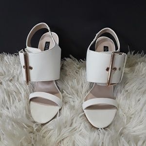 Sling back white heels.